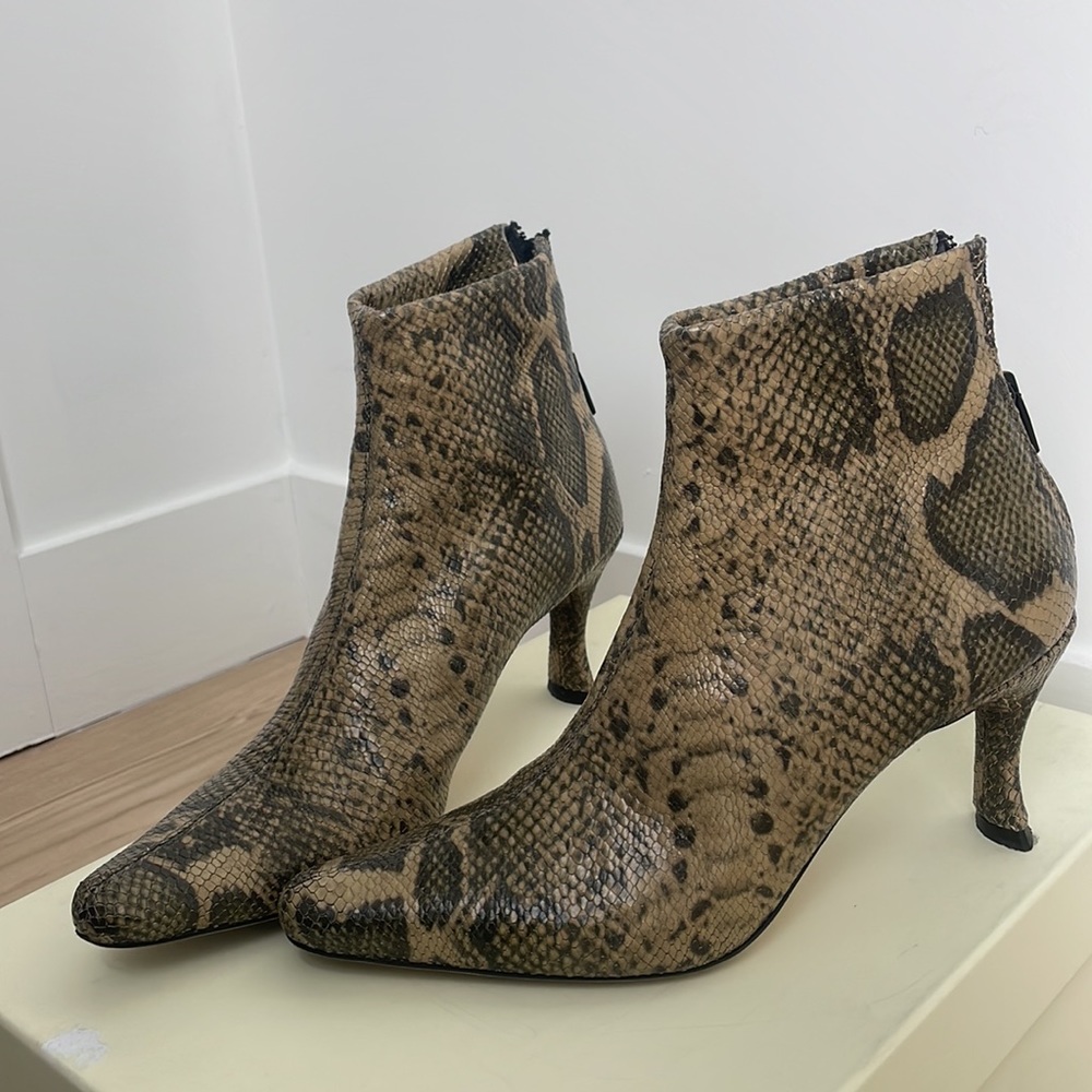 ByFar Stevie snake print leather booties.